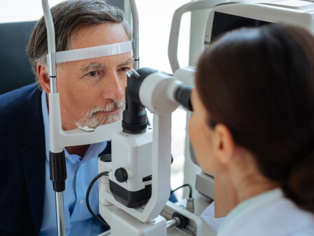 elderly man undergoing eye exam at premier eye associates