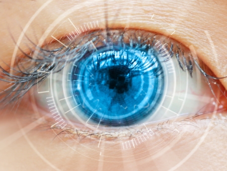 eye doctor putting eye drops in older female patient